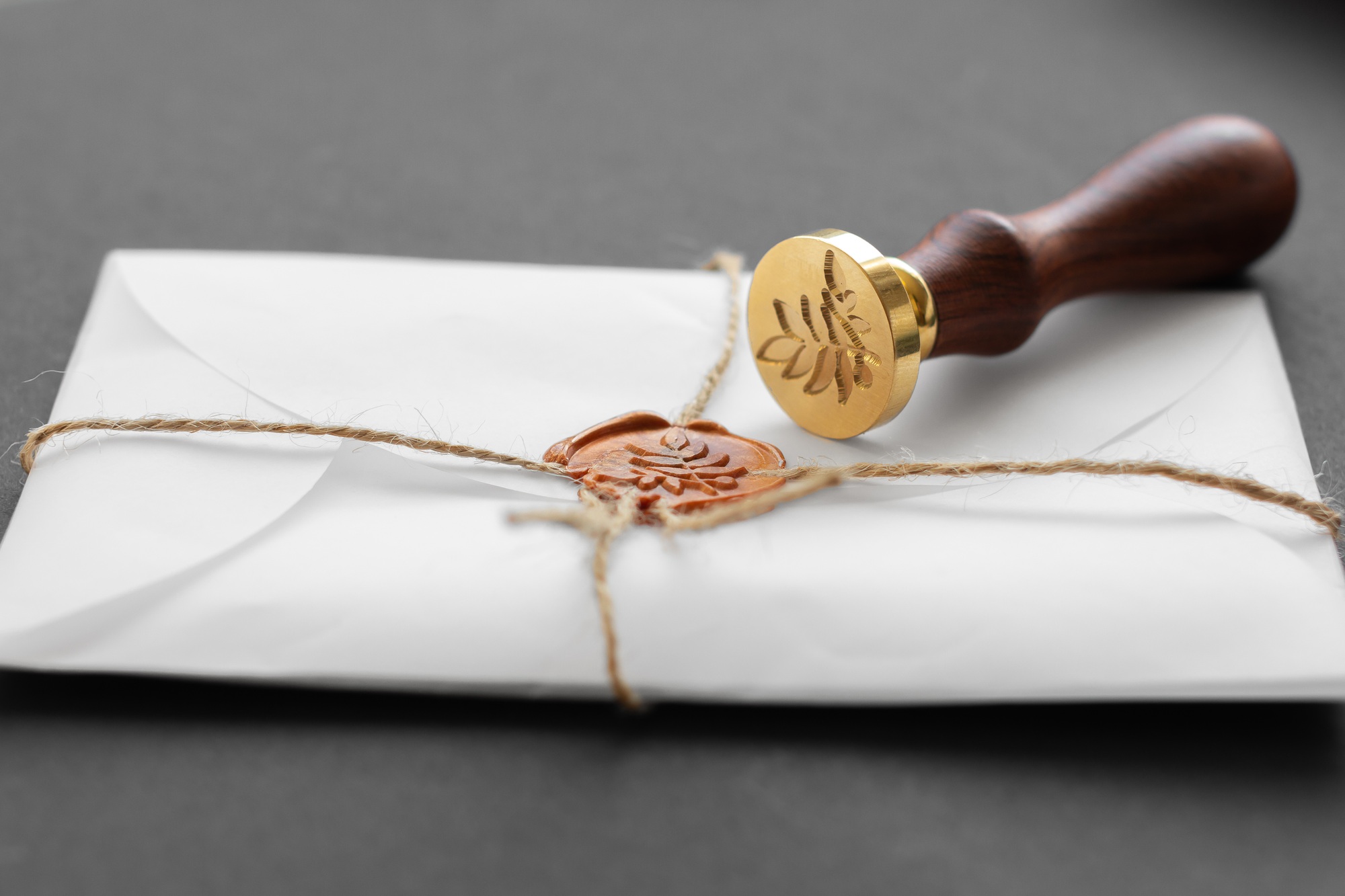 Notary public wax stamper. White envelope with brown wax seal, golden stamp. Responsive design